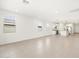 Open-concept living room with tile floors, white walls, and recessed lighting at 4287 W Jeanette Ln, San Tan Valley, AZ 85144