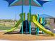 Close-up view of a colorful playground structure with slides at 4287 W Jeanette Ln, San Tan Valley, AZ 85144