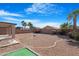 Large backyard with gravel and putting green at 43815 W Carey Dr, Maricopa, AZ 85138