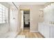 Elegant bathroom with marble shower and double vanity at 43815 W Carey Dr, Maricopa, AZ 85138