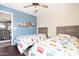 ' bedroom with twin beds and blue accent wall at 43815 W Carey Dr, Maricopa, AZ 85138