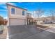 Two-story house with a beige exterior, two-car garage, and landscaped front yard at 43815 W Carey Dr, Maricopa, AZ 85138