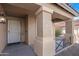 Front entrance with double columns, a screened door, and a house number at 43815 W Carey Dr, Maricopa, AZ 85138