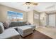 Bright Gathering room with sectional sofa, hardwood floors, and a window view at 43815 W Carey Dr, Maricopa, AZ 85138