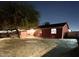 Night view of a single-story home with a yard at 4417 N 70Th Ave, Phoenix, AZ 85033