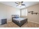 Small bedroom with gray platform bed and nightstand at 4647 E County Down Dr, Chandler, AZ 85249