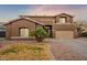 Two-story house with brown exterior, landscaping, and a two-car garage at 4647 E County Down Dr, Chandler, AZ 85249