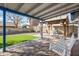 Backyard patio with pergola, swing, and artificial turf at 4749 E Evergreen St, Mesa, AZ 85205