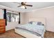 Spacious bedroom with large bed and ceiling fan at 4749 E Evergreen St, Mesa, AZ 85205