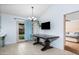 Dining area with dark wood table and access to backyard at 4749 E Evergreen St, Mesa, AZ 85205