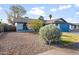 Front yard view of a single story home with rock landscaping at 4749 E Evergreen St, Mesa, AZ 85205