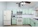 Light green kitchen with stainless steel appliances at 4749 E Evergreen St, Mesa, AZ 85205