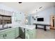 Light green kitchen with stainless steel appliances and tile floor at 4749 E Evergreen St, Mesa, AZ 85205