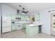 Kitchen with light green cabinets and an island at 4749 E Evergreen St, Mesa, AZ 85205