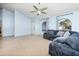 Bright living room with sectional sofa and tiled flooring at 4749 E Evergreen St, Mesa, AZ 85205