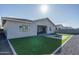 Backyard view of home with artificial turf and fire pit at 5080 N 184Th Ln, Litchfield Park, AZ 85340