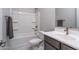 Clean bathroom with tub shower combo and modern vanity at 5080 N 184Th Ln, Litchfield Park, AZ 85340