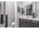 Guest bathroom with single sink vanity and toilet at 5080 N 184Th Ln, Litchfield Park, AZ 85340