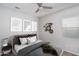 Well-lit bedroom with ceiling fan and large window at 5080 N 184Th Ln, Litchfield Park, AZ 85340