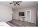 Main bedroom with a TV and built in shelving at 5080 N 184Th Ln, Litchfield Park, AZ 85340