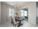 Bright dining area with wood table and access to backyard patio at 5080 N 184Th Ln, Litchfield Park, AZ 85340