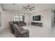 Relaxing living room with a sectional sofa and large TV at 5080 N 184Th Ln, Litchfield Park, AZ 85340