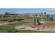 Community playground with play structures and shaded seating at 5080 N 184Th Ln, Litchfield Park, AZ 85340