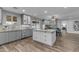 Open concept kitchen with granite countertops, a center island, and views into the connected dining area at 5249 E Thunderbird Rd, Scottsdale, AZ 85254