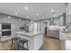 Beautiful kitchen with granite countertops, stainless steel appliances, and center island with barstool seating at 5249 E Thunderbird Rd, Scottsdale, AZ 85254