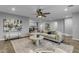 A cozy living room extends to the dining area and kitchen, showcasing an open floor plan at 5249 E Thunderbird Rd, Scottsdale, AZ 85254