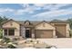 Single-story home with two-car garage and desert landscaping at 6812 N 190Th Ave, Waddell, AZ 85355