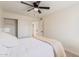 Inviting bedroom with a ceiling fan, and closet leading to hallway provides comfortable living space at 7326 N 43Rd Ave, Glendale, AZ 85301