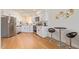 Bright and modern kitchen with white cabinets, countertops, and stainless steel appliances at 7326 N 43Rd Ave, Glendale, AZ 85301