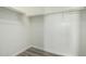 Walk-in closet features white walls, a gray floor, and a clothing rod for storage at 7420 W Glass Ln, Laveen, AZ 85339