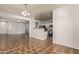 Kitchen and dining area with tile floors and breakfast bar at 7420 W Glass Ln, Laveen, AZ 85339