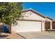 View of the house's garage and a portion of the front yard at 7420 W Glass Ln, Laveen, AZ 85339