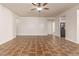 Bright living room featuring tile flooring and a ceiling fan at 7420 W Glass Ln, Laveen, AZ 85339