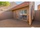 Exterior view of the property showing the entrance and sliding glass door at 7448 N 43Rd Dr, Glendale, AZ 85301