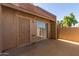 Exterior view of the property showing the entrance and sliding glass door at 7448 N 43Rd Dr, Glendale, AZ 85301