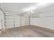 Attached garage with overhead door and storage shelving at 7448 N 43Rd Dr, Glendale, AZ 85301