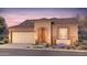 Single-story home with Spanish-style tile roof and desert landscaping at 7658 W Cactus Wren Way, Florence, AZ 85132