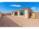 Desert backyard with a simple patio, awaiting your personal landscaping touches at 7659 W Cactus Wren Way, Florence, AZ 85132