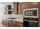 Close-up of a kitchen featuring stainless steel gas range and modern appliances at 7659 W Cactus Wren Way, Florence, AZ 85132