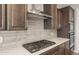 Close-up of a kitchen featuring stainless steel gas range and modern appliances at 7659 W Cactus Wren Way, Florence, AZ 85132