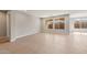 Bright and airy living room with tile floors and large windows at 7659 W Cactus Wren Way, Florence, AZ 85132