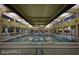 Indoor lap pool with tiled floor and large windows at 7659 W Cactus Wren Way, Florence, AZ 85132