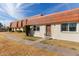 Charming exterior view of a well-maintained townhome with a tile roof and tidy landscaping at 7810 N 47Th Ave, Glendale, AZ 85301