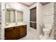 Bathroom with floral wallpaper and a shower/tub combo at 7837 E Crestwood Way, Scottsdale, AZ 85250