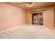 Bright bedroom with sliding door to patio access at 7837 E Crestwood Way, Scottsdale, AZ 85250