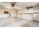 Garage interior with ample storage cabinets and shelving at 7837 E Crestwood Way, Scottsdale, AZ 85250